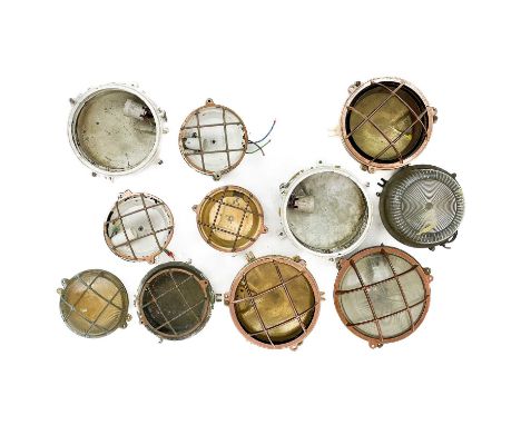 A collection of marine bulkhead circular light fittings. Largest diameter 21cm. (box)