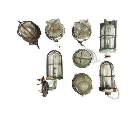 Eight marine bulkhead light fittings. Largest 19cm.