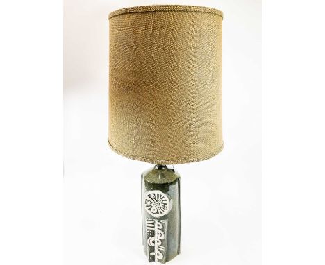 A Tremaen pottery Kenegie lamp base. In green glaze with original shade, height 52cm.No condition issues, it is in need of be