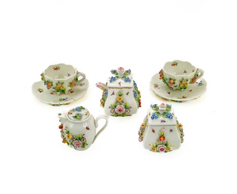 A 19th century Sitzendorf porcelain miniature tea set. With painted insects and flower encrusted decoration comprising: teapo