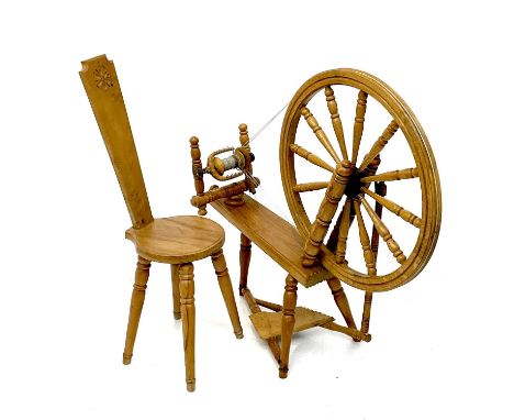 An oak spinning wheel and chair. By William Clarke dated, stamped and signed, height 100cm length 105cm. (2)The wheel and tre