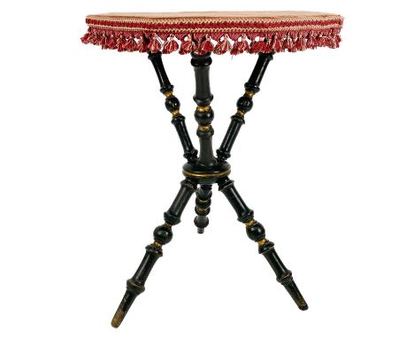 A late Victorian octagonal ebonized and gilt Gypsy table. With bobbin tripod supports, height 63.5cm.Rubbing to the gilt, one