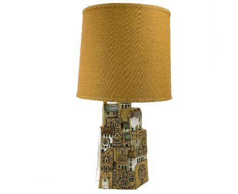 A Tremaen pottery large village table lamp. Moulded to each side with the steep Cornish harbourside buildings, height 39cm, w