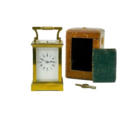 A French brass cased repeater carriage clock. Circa 1880, by Richard et Cie, height 14.5cm, in leather travel case.