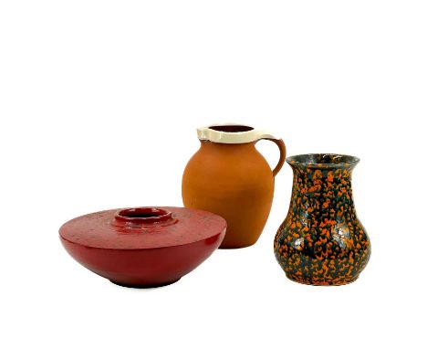 A Royal Barum Ware Terracotta Jug by Brannam Ltd together with other pottery items. Height of jug 22cm; together with a potte