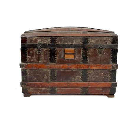 A Victorian slatted metal bound domed topped trunk.  Height 66cm width 82cm depth 47cm.