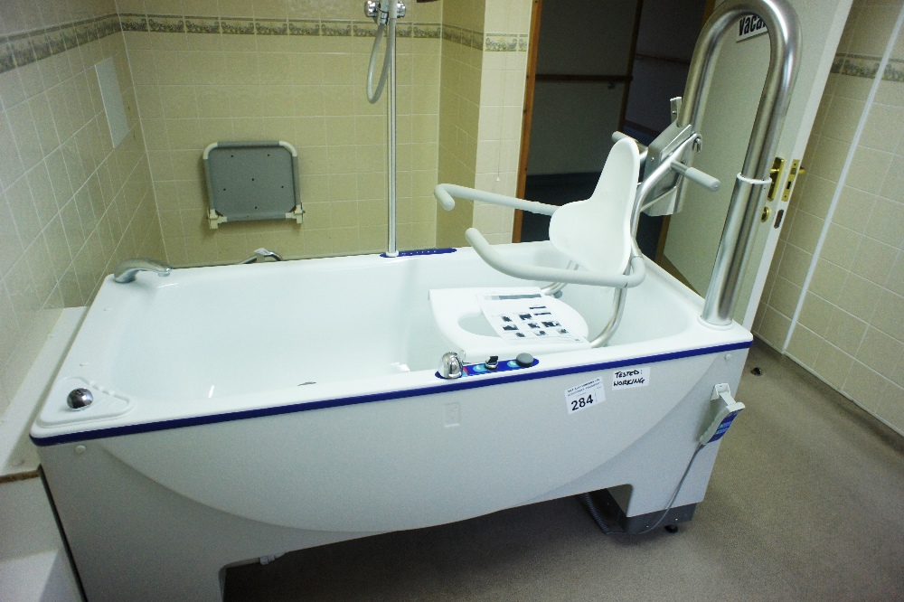 an Arjo Malibu electrically operated rise and fall patient bath with