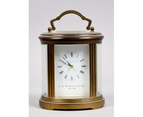 A late 20c Matthew Norman carriage clock in oval glazed brass case, the rectangular white dial marked for the retailer H.A By