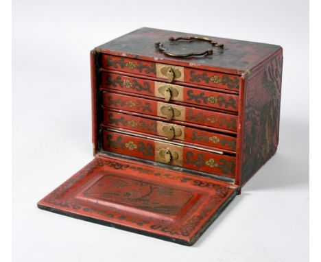 A late 19c Oriental mah jong set contained in a red lacquered box with incised script and landscape decoration, the lid up fr