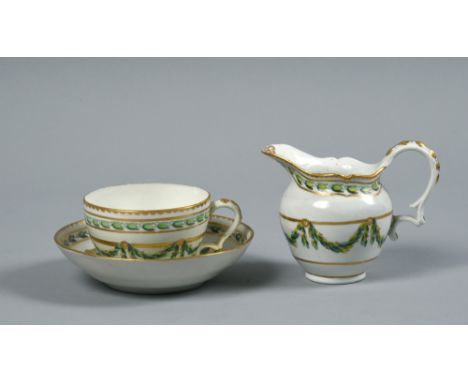 A Bristol cup, saucer and milk jug, all painted with green leafy garlands within a gilt dentil and gilt line borders, all a/f