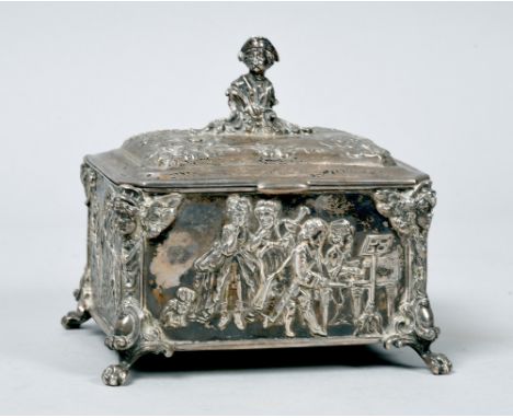 An early 20c Dutch style silver casket, the hinged slightly domed cover with a figurative finial, the base with embossed and 