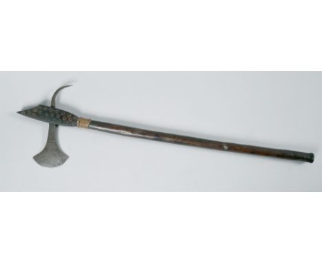 A 19c African battle axe with carved shaft, iron axe head and spike, 22in l.