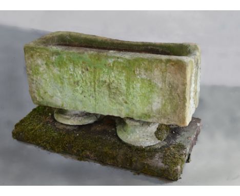 A late 18c/early 19c stoneware drinking trough, raised on two stoneware columns on a platform base, the trough 33in l, 12.5in