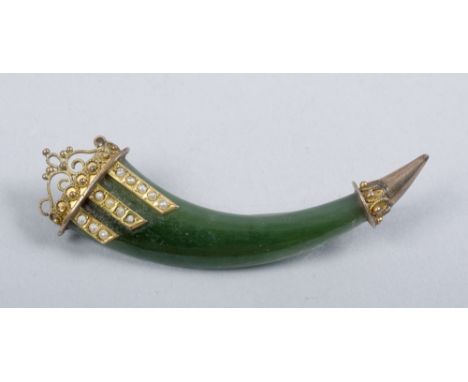 A 19c Indian green stone and gold mounted cornucopia brooch, seed pearl set, 2.25in l.