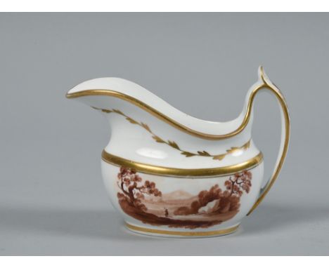 An early 19c Spode creamer painted in brown with a landscape within gilt borders, 5.75in w.