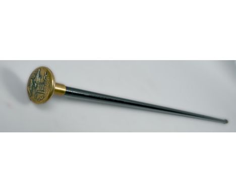 An early 20c ebonised swagger stick, the brass handle embossed with a scene of two early aircraft, 31in l.