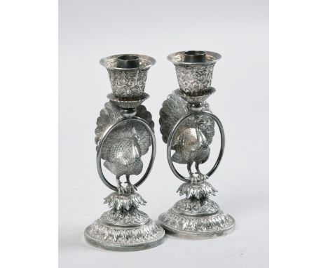 A pair of late 19c Indian silver peacock candlesticks by Oomersi Mawsi, stamped OM Bhuj, 17oz total, 6.75in h - small solder 