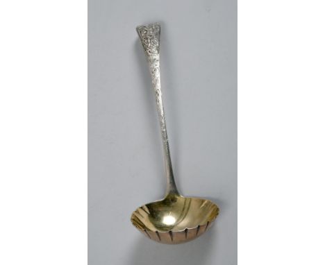 A late George lll silver Old English serving ladle with cherub terminal and gilt lined bowl, London 1814, 8.75in l.