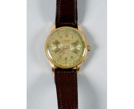 A 1950's chronograph Swisse gentleman's watch, the case with two tone gold dial and 18ct gold back.  The chronograph movement