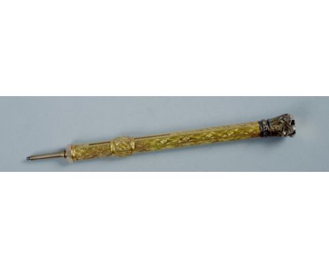 An Edwardian gilt metal propelling pencil with hexagonal barrel and seal top terminal, 5in l open.