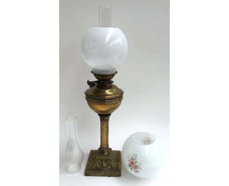 A 19th century brass brass oil lamp 'Thermidor Belge Patd. 1884', with two glass chimneys, and two glass shades 