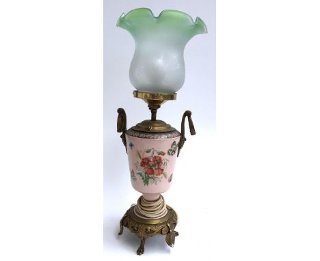 A brass and ceramic lamp, converted for electrical use 