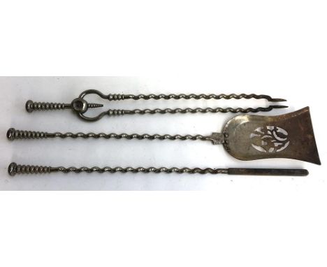 A set of barleytwist fire tools, comprising poker, shovel, and tongs 