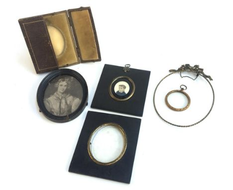 A 19th century miniature portrait on bone, together with several other miniature picture frames, one containing a black and w