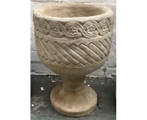 A composite stone urn planter with guilloche freize decoration, on stand 