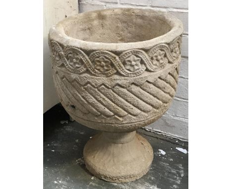 A composite stone urn planter with guilloche freize decoration, on stand 