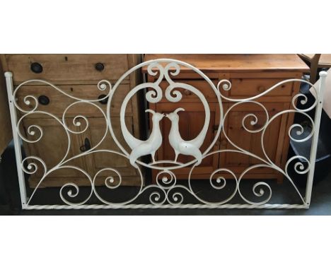 A white painted wrought iron bed head depicting two birds, 140cmW 