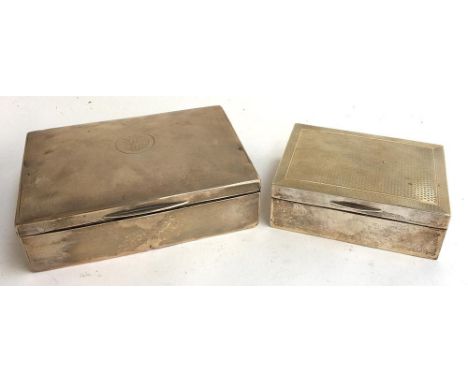 An early 20th century silver engine turned cigar box, marks rubbed, 11.5cmW; together with another by A &amp; J Zimmerman Ltd