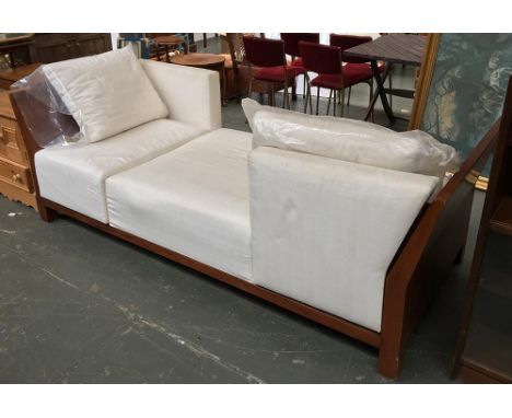 A contemporary upholstered day bed, with three removable upholstered sections and two loose cushions, 227x95cm 