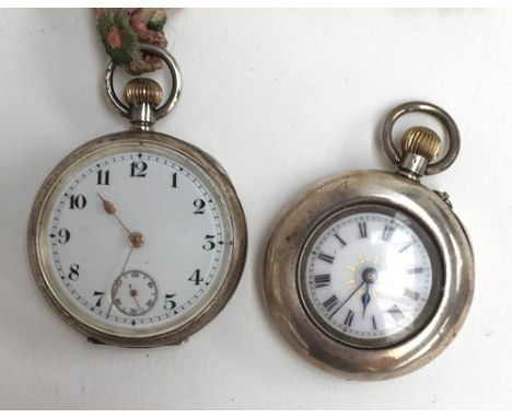 A silver Omega pocket watch with subsidiary seconds dial, the engine turned case marked Omega, 0.925, with London import mark