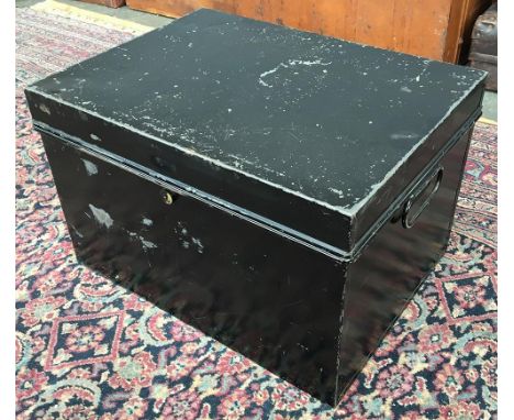 A black painted metal travel trunk 