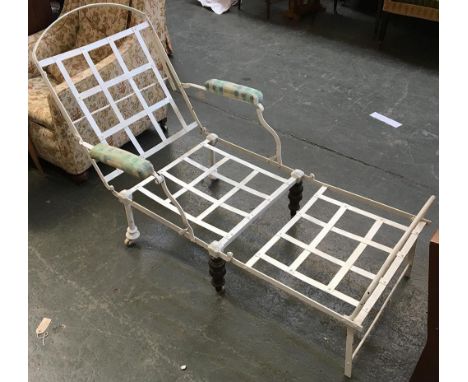 A white painted folding iron day bed with turned brass legs 