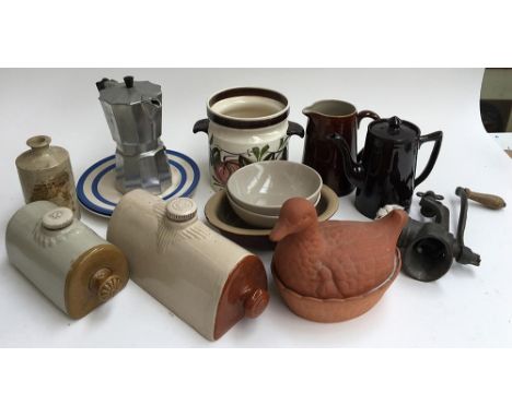 A mixed lot to include two stoneware hot water bottles, a mokka pot, meat grinder, coffee pots, etc 