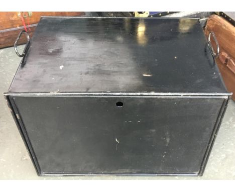 A black metal travel trunk with fall front and loop carry handles 