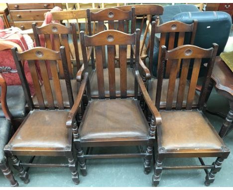 A set of six stained oak dining chairs, two carvers, with bobbin turned supports 