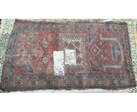 A West Persian carpet, with patch repairs, 200x120; together with a very large Persian carpet with repairs, 310x230cm 