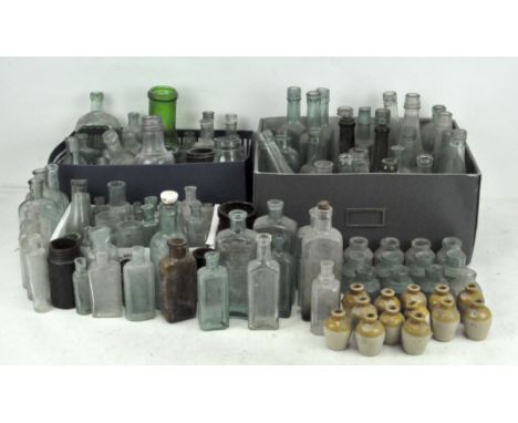 A large collection of vintage glass bottles, in assorted colours, shapes and sizes