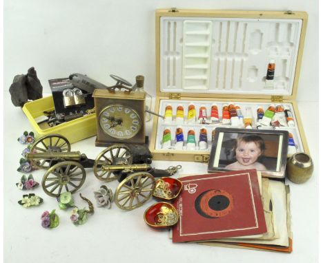 A model US Air Force Reconnaisance plane, together with two model cannons, a selection of padlocks, a quartz mantel clock and