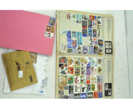 A vintage Stanley Gibbons stamp album containing a selection of GB and rest of the world stamps