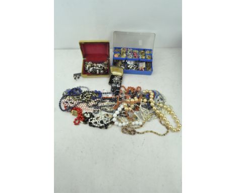 An assortment of vintage costume jewellery, necklaces, earrings and more