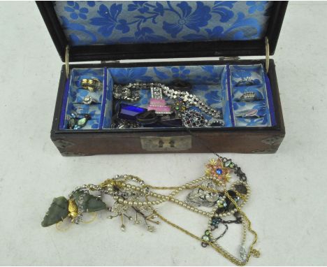 A Chinese box containing vintage jewellery, including rings and other pieces