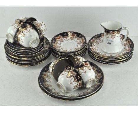 A Royal Albert Crown china tea service, decorated with blue and gilt floral sprays on a white ground