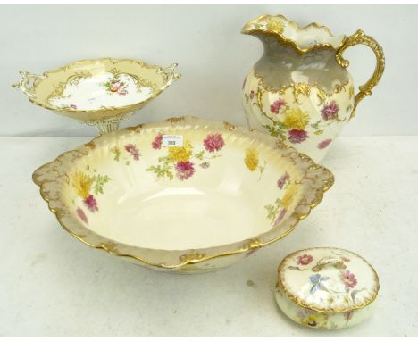 A group of porcelain comprising a wash jug, basin and soap tray with gilt and floral decoration on a cream ground, together w