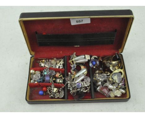 A vintage box of assorted earrings, all in a jewellery box