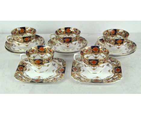 A late 19th/early 20th century ceramic tea set, decorated with blue and gilt floral sprays on a white ground, comprising tea 