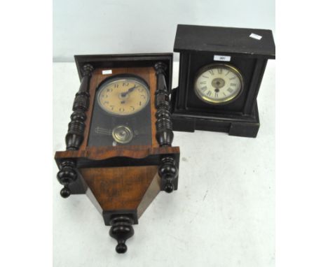 A 20th Century wall clock, enamel dial with Arabic numerals within an oak case, together with a wooden framed mantel clock, m
